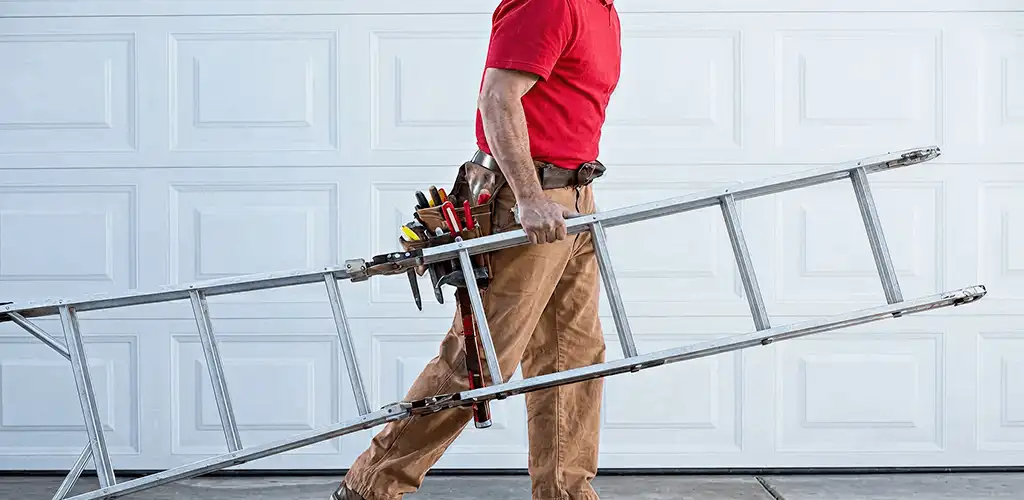 Garage door repair technician arriving with tools and ladder in Denver, CO