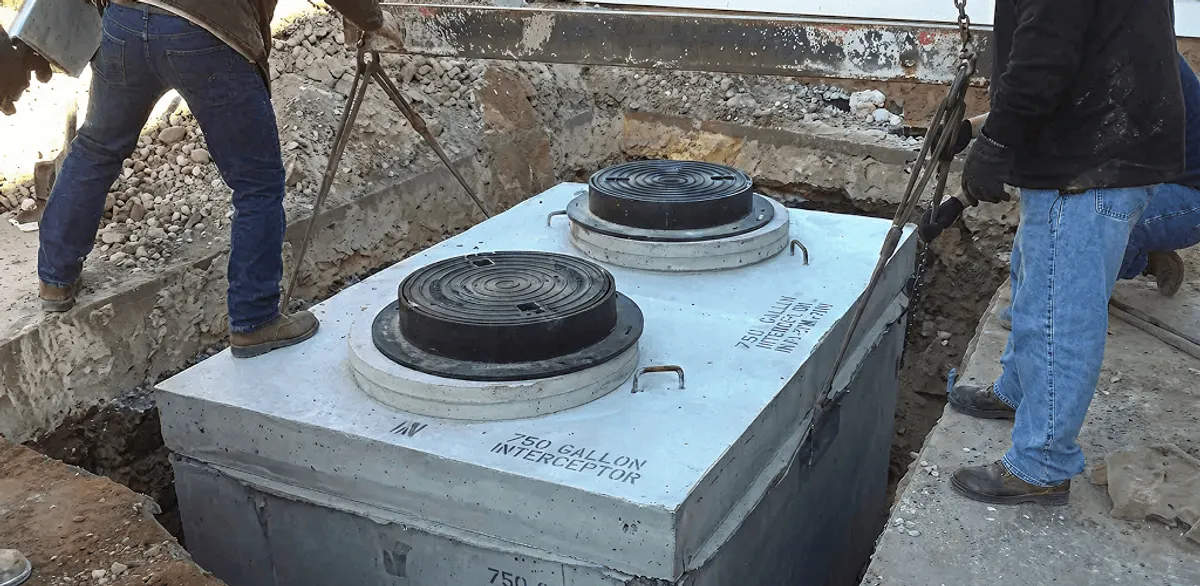 Grease trap installation for a commercial property drainage system in Denver, CO