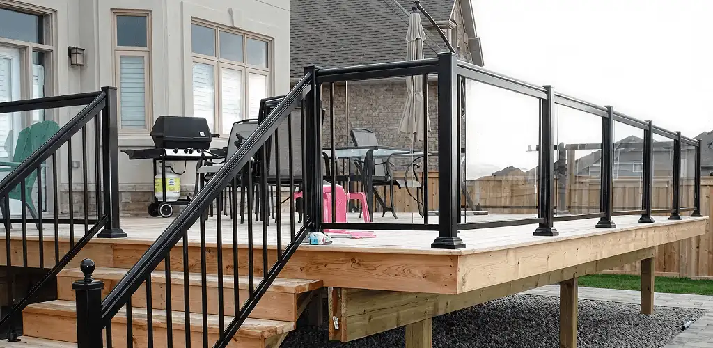 Handrail installation on a deck staircase for safety and code compliance in Denver, CO