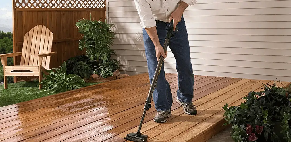 Deck staining service applying stain to a backyard wood deck in Denver, CO